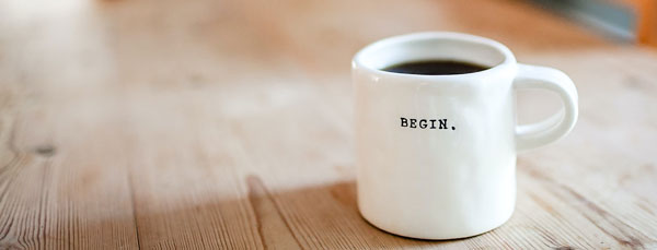 Coffee Mug that says "Begin"